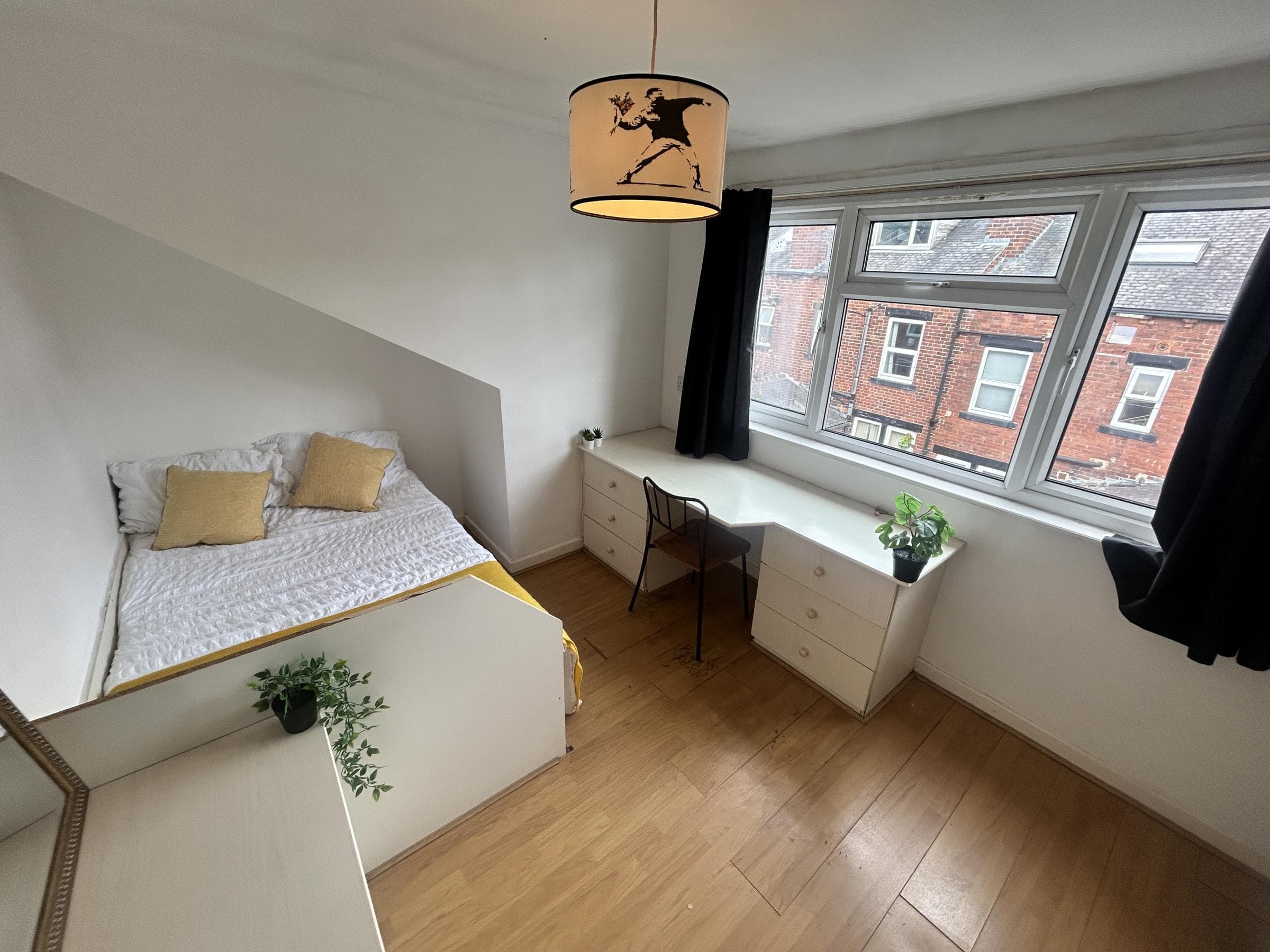 Top-floor bedroom with desk
